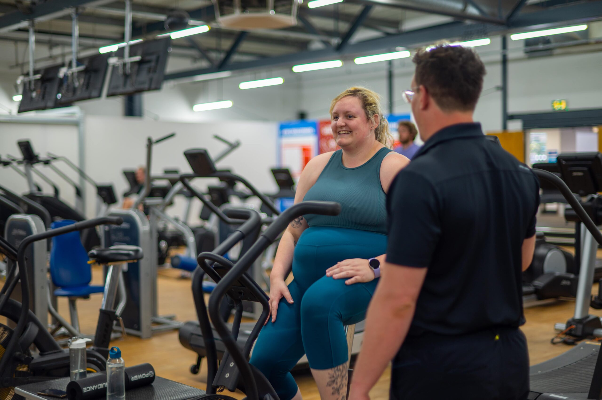 Personal Training Jobs at Horizon - a woman sitting on an exercise bike in a gym