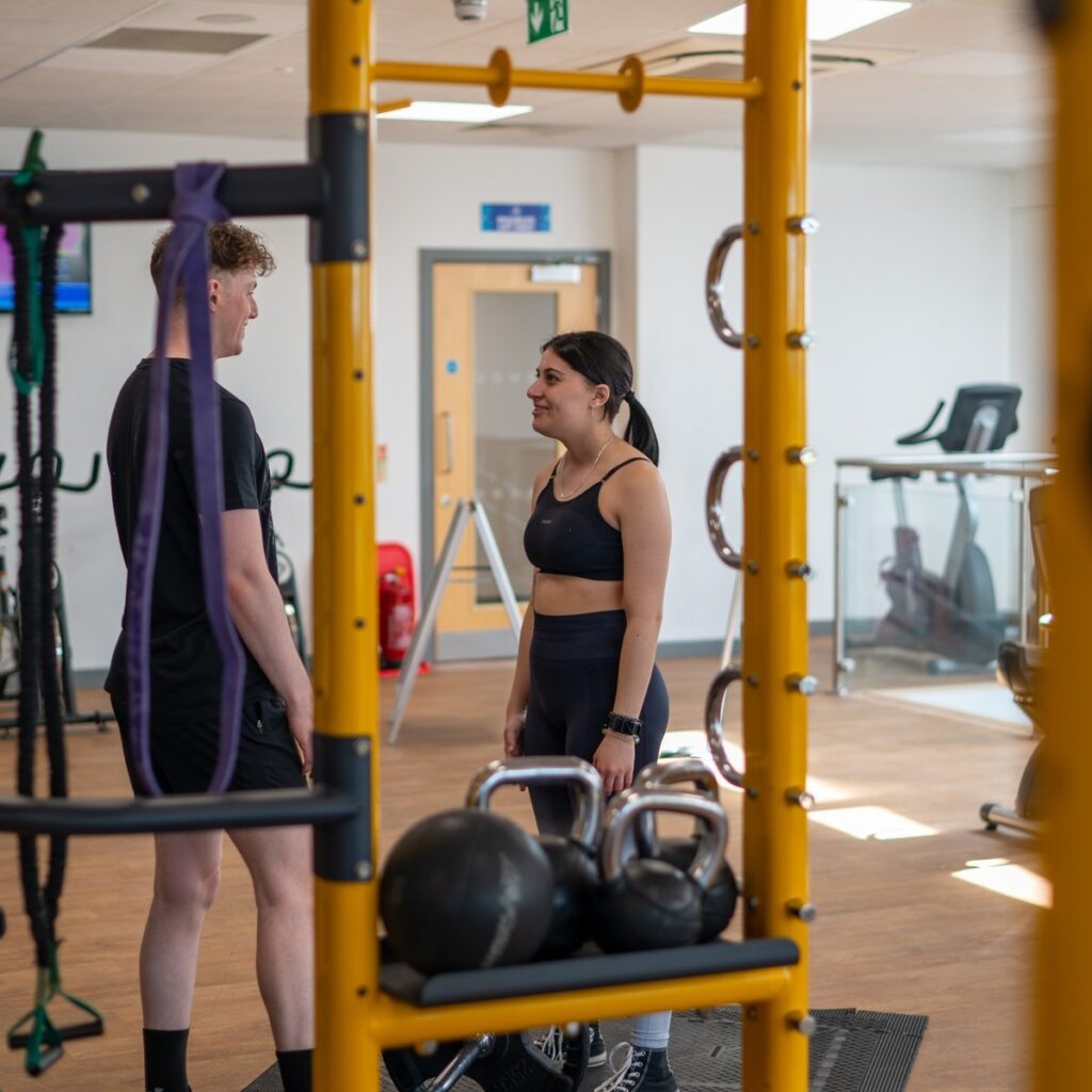 a man and woman in a gym using our bring a friend for free offer to combat the feelings of blue Monday