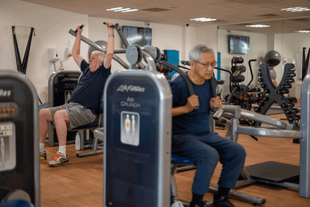 Two men exercising in Waterlooville gym as part of our health referral scheme