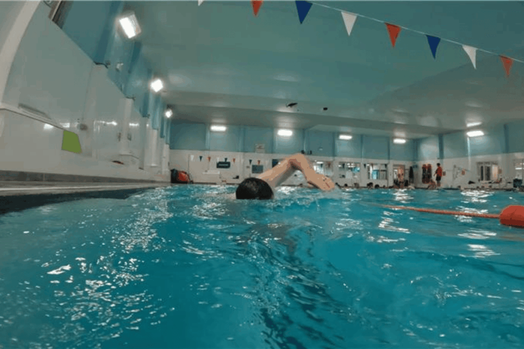 A man swimming in one of our adult swimming lessons