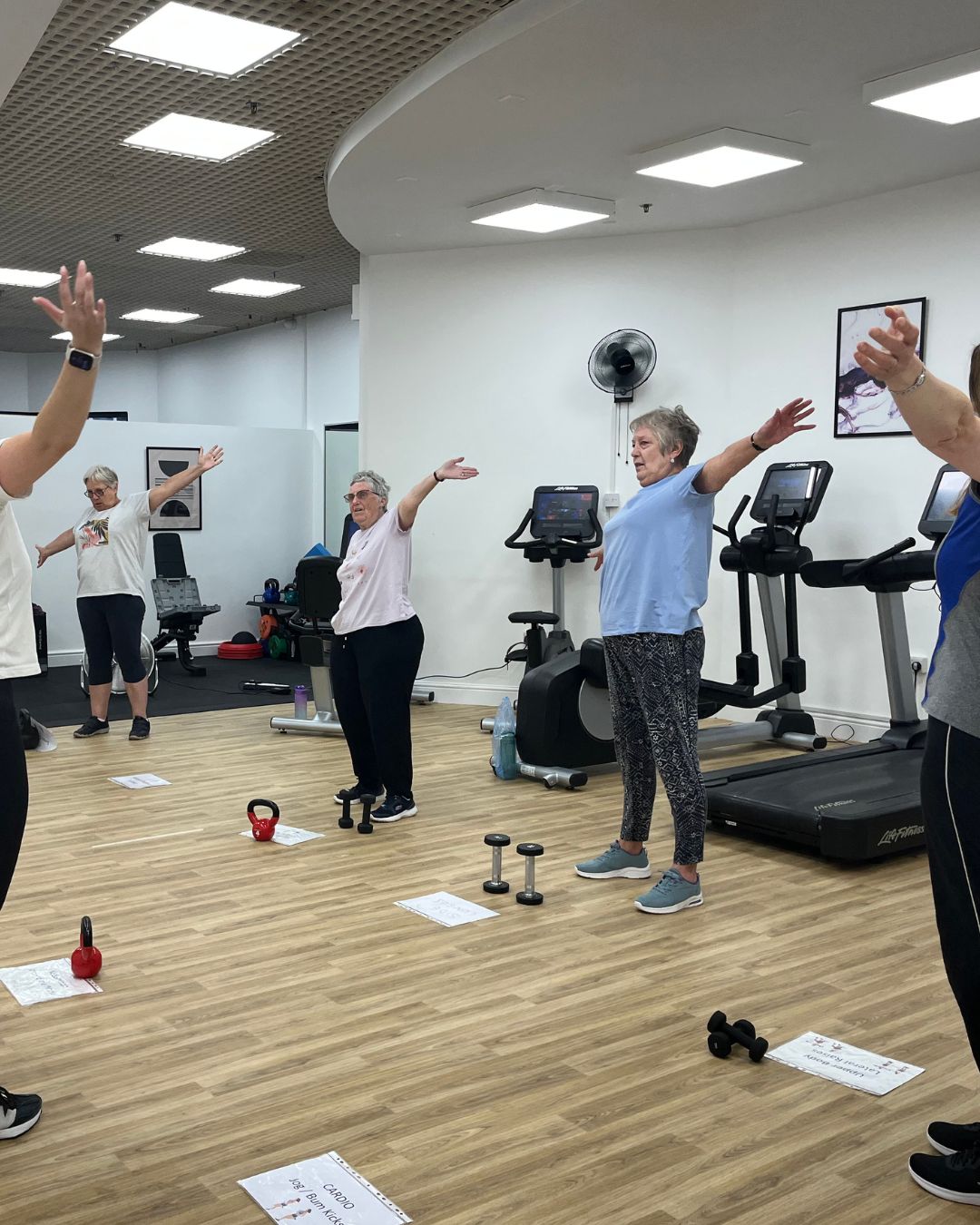 mental health Group exercise session in fitness studio.