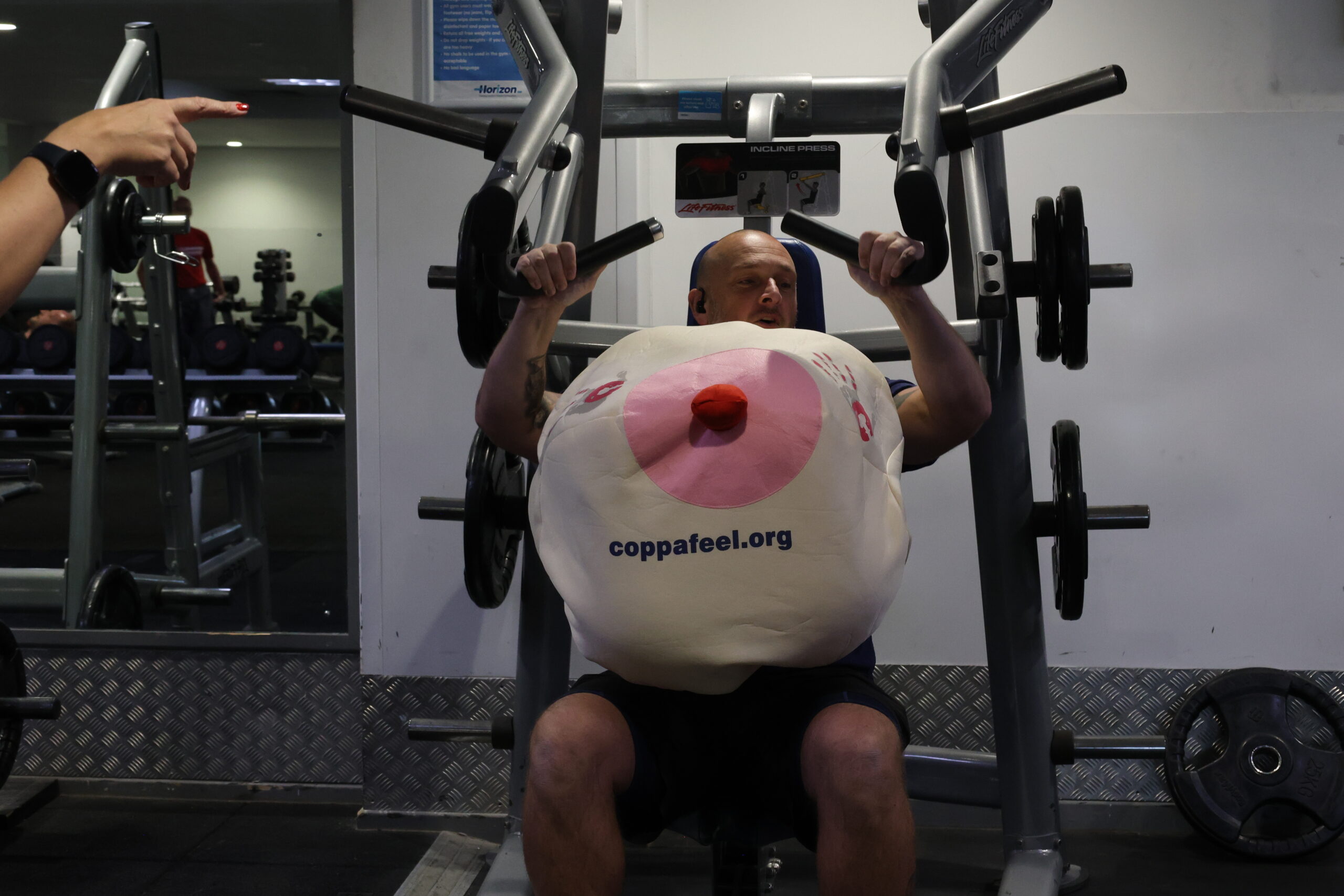 Person exercising with a large prop.