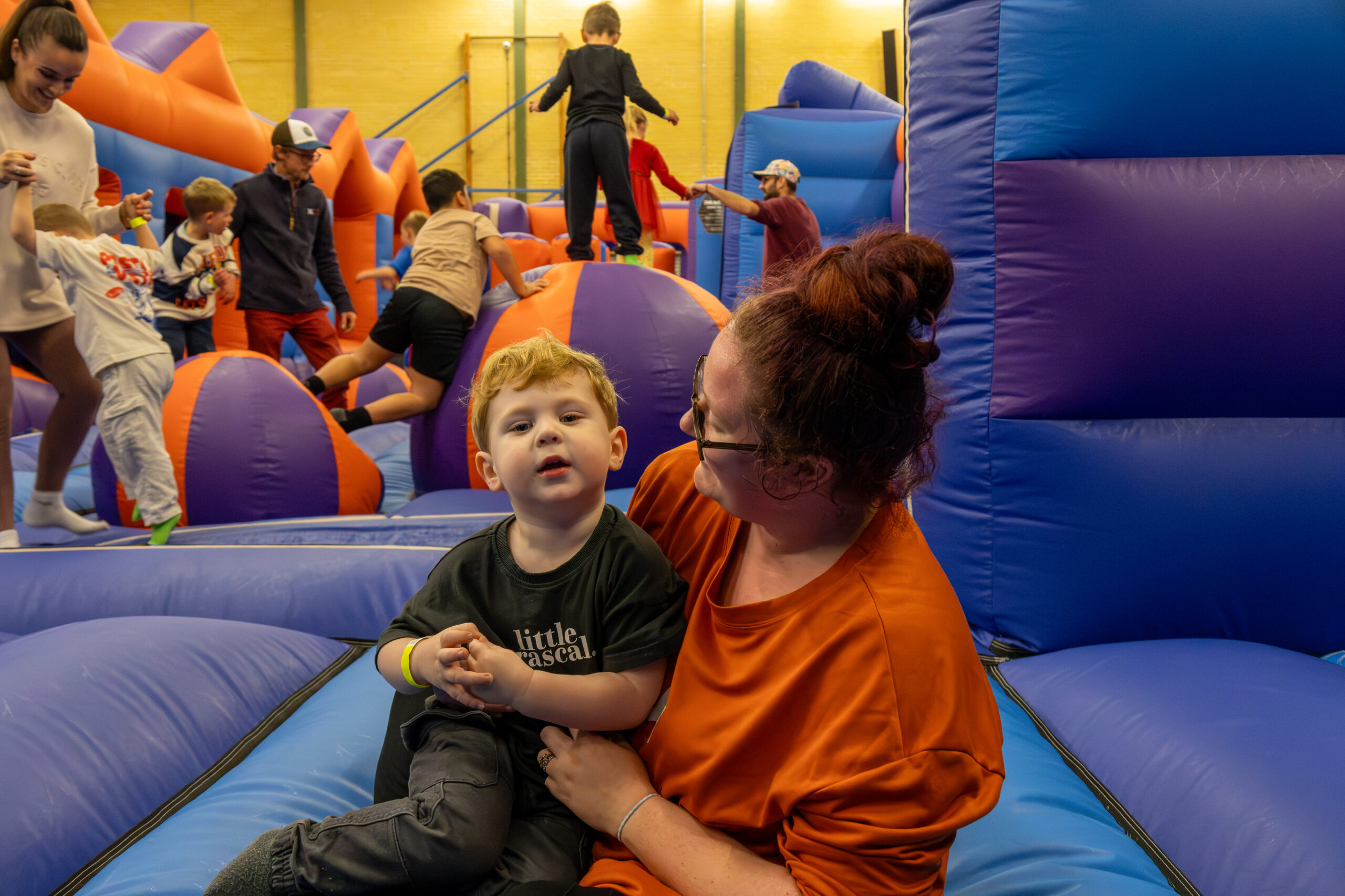 Children playing on inflatable structures.