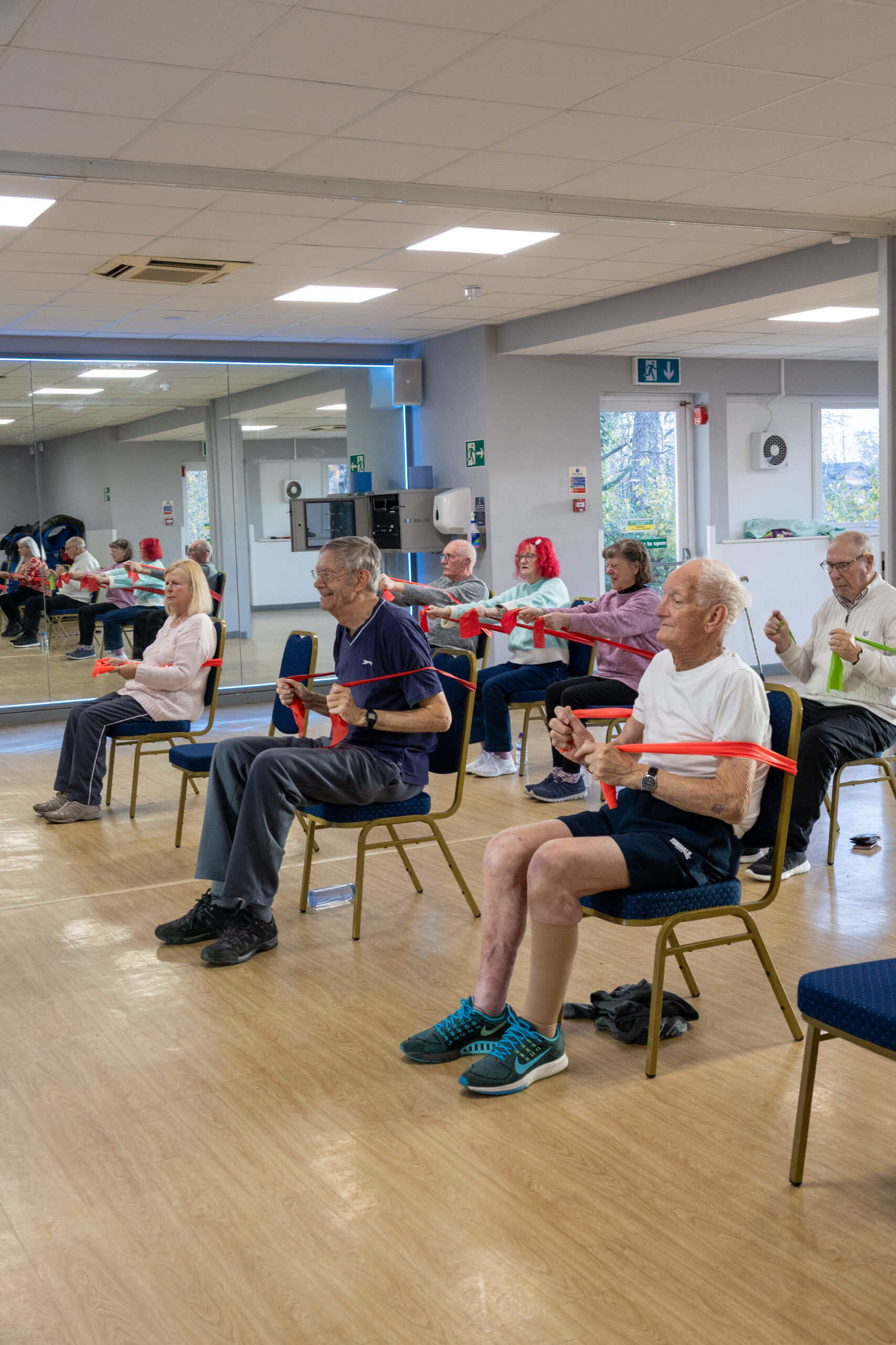 Seniors exercising with resistance bands Movember at Horizon.