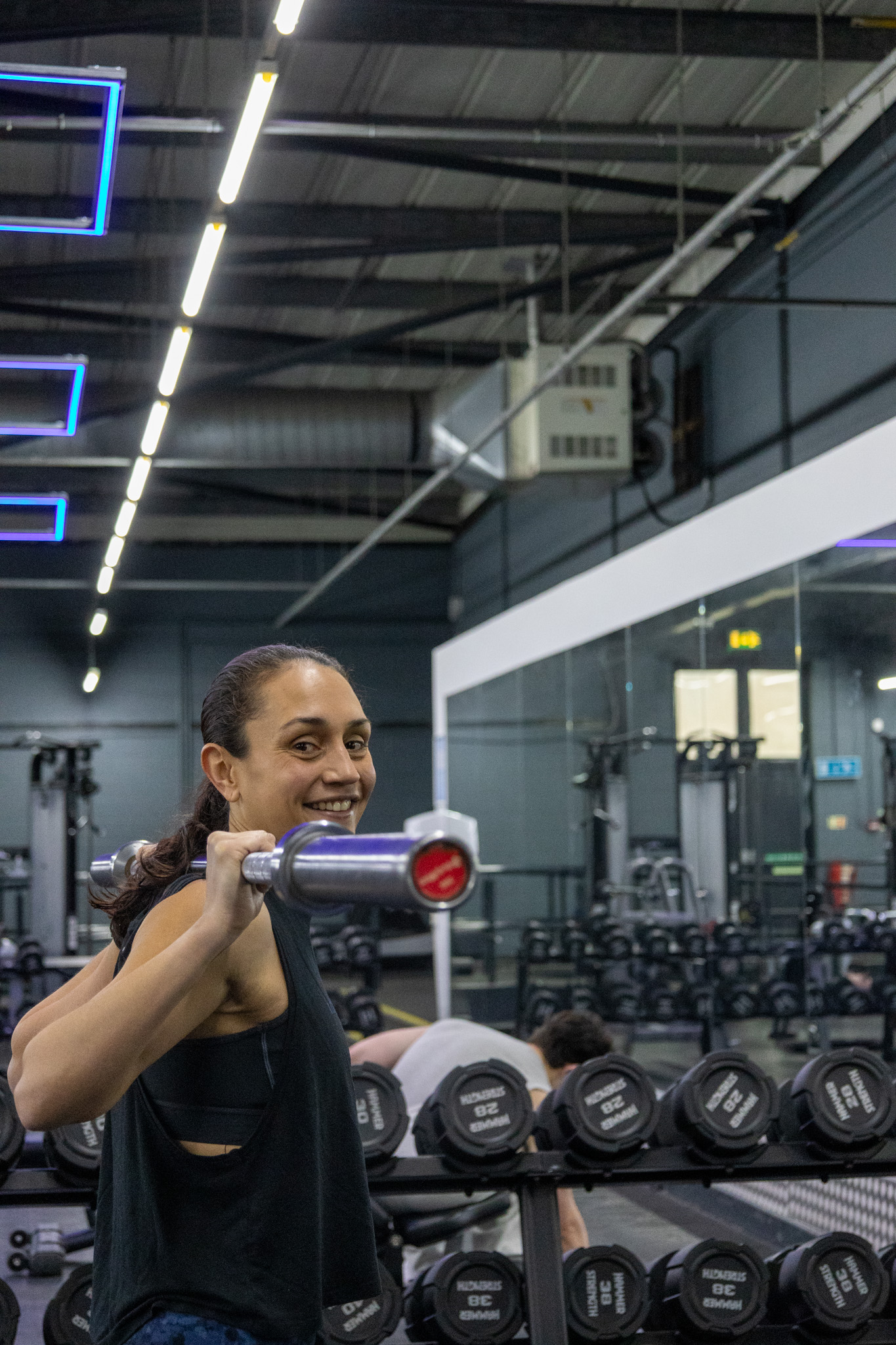 Person lifting weights in gym for flash sale no joining fee